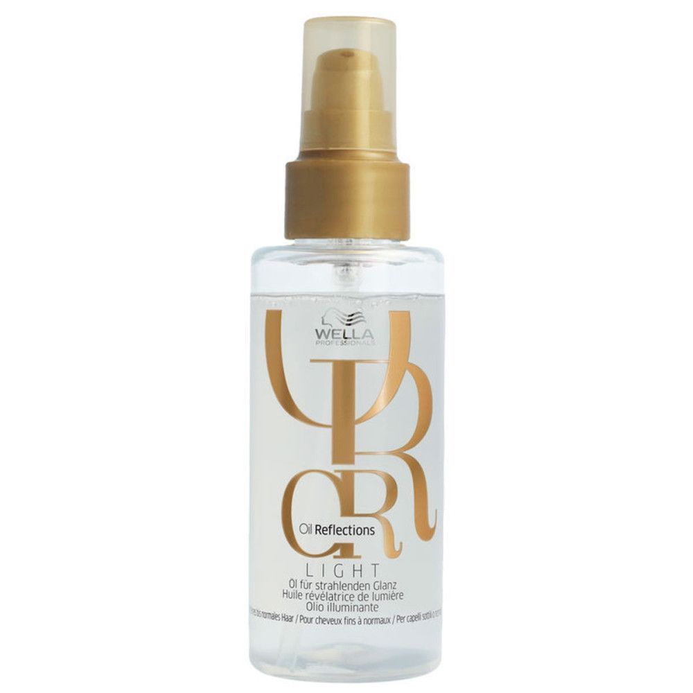 Flacon transparent avec vaporisateur doré. Inscription: Wella Oil Reflections Light.