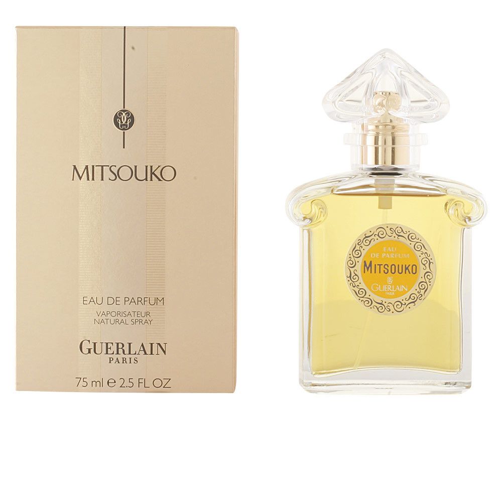 Fles en verpakking van Guerlain Mitsouko Eau de Parfum. Vierkante fles, gouden dop. Beige verpakking met tekst.