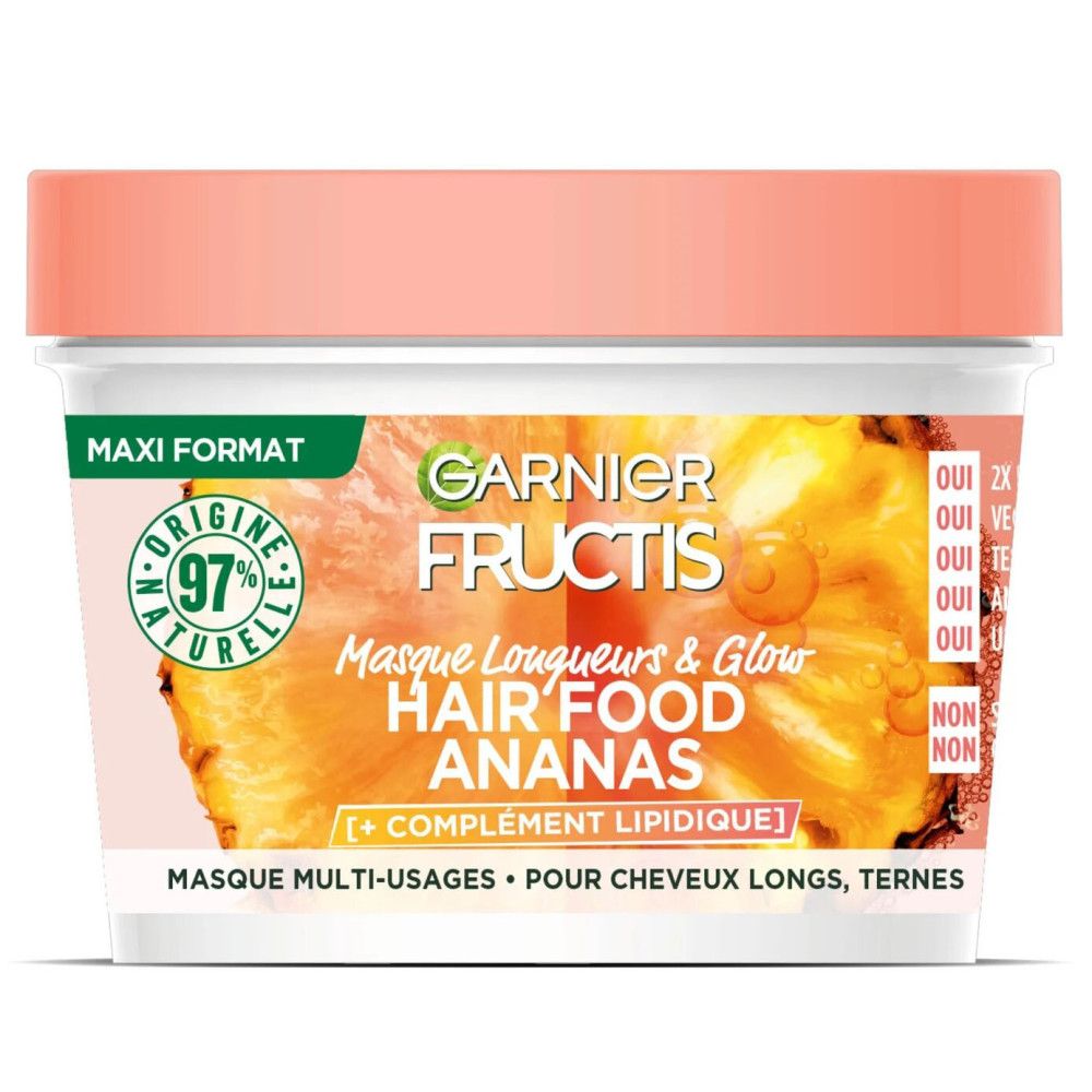 Pot blanc avec couvercle rose. Inscription: Garnier Fructis Hair Food Ananas. Autocollant vert et blanc: 97% ingrédients naturels.
