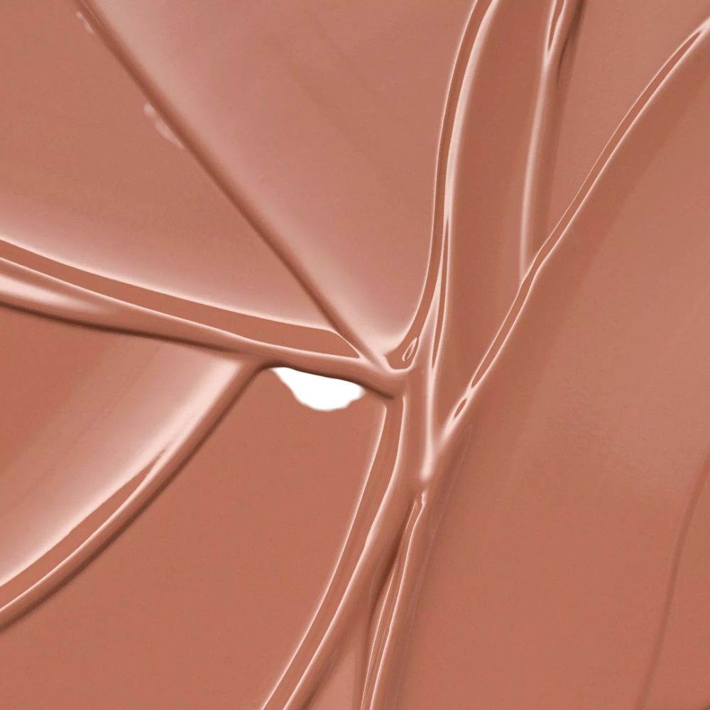 Gros plan sur du rouge à lèvres. Rouge à lèvres nude, brillant.