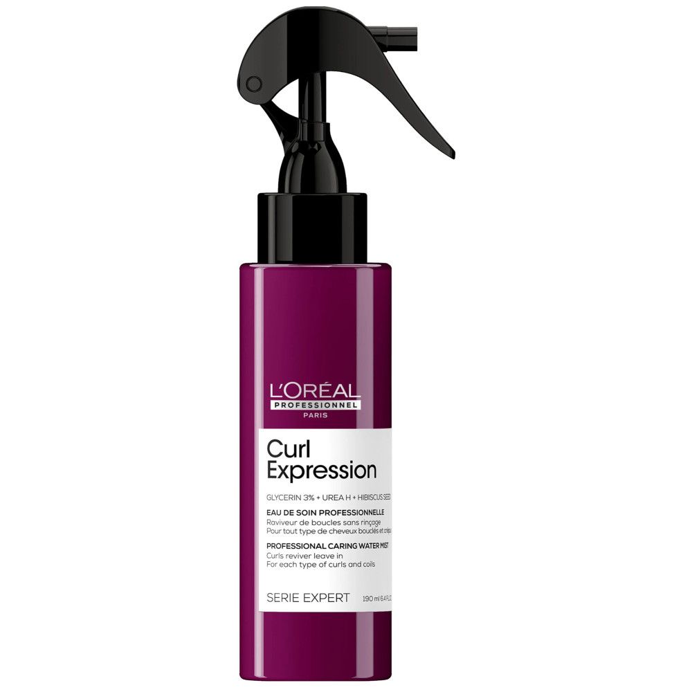 Fles L'Oréal Professionnel Curl Expression. Paarse fles met zwarte spraykop. Productnaam en tekst zichtbaar.