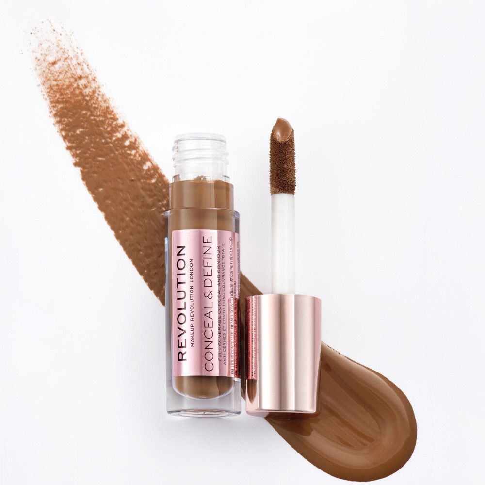 Flacon de correcteur avec applicateur. Marque et nom visibles.