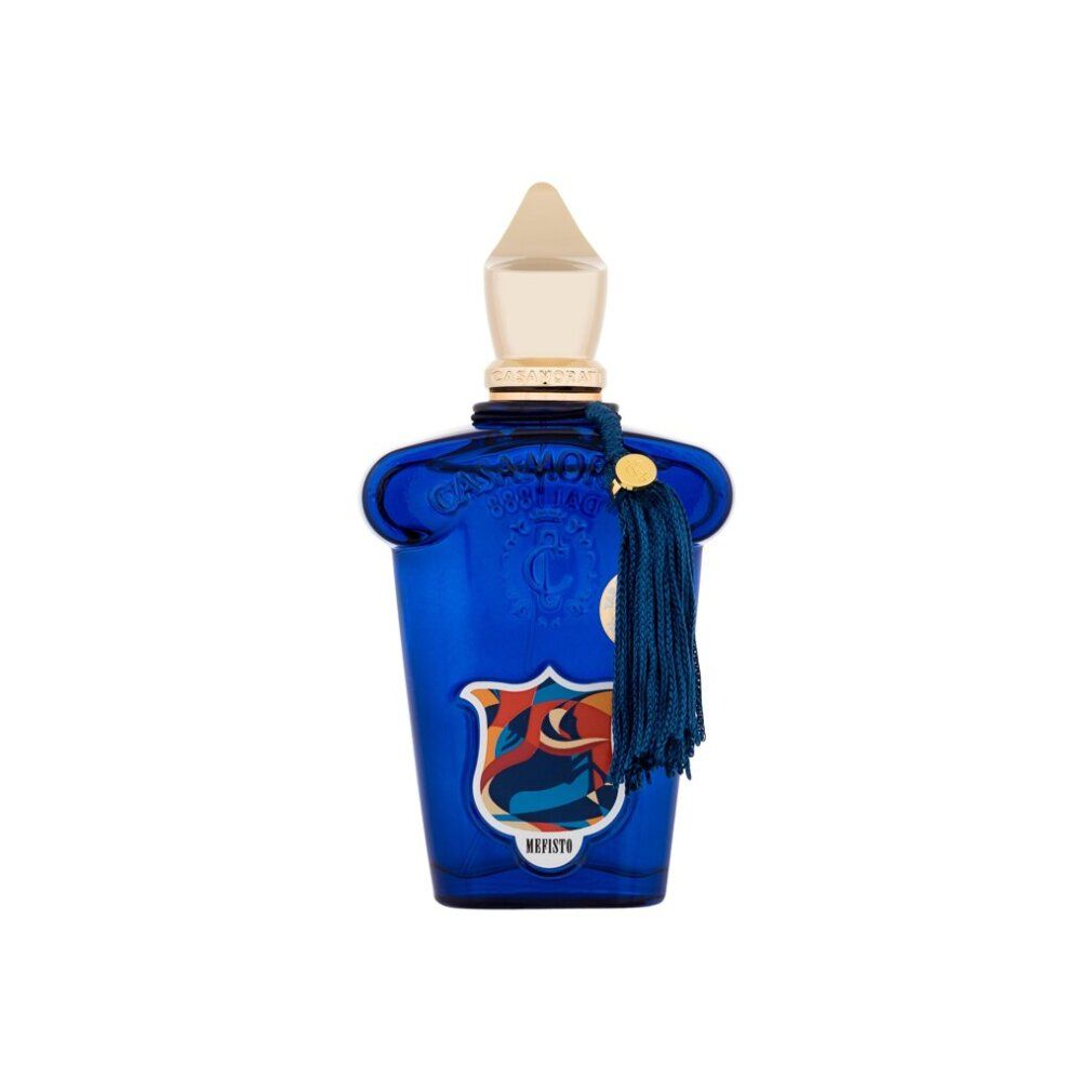 Flacon bleu avec bouchon doré et pompon. Inscription Mefisto. Flacon avec emblème coloré.