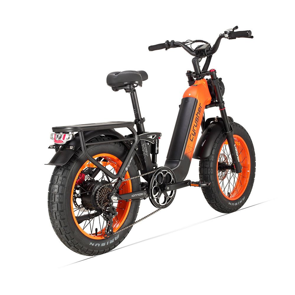 Cyrusher e-bike, oranje en zwart. Brede banden, bagagerek, achterlicht.