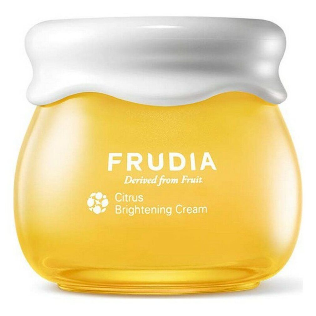 Crème éclaircissante aux agrumes Frudia dans un pot en verre jaune avec un couvercle blanc.