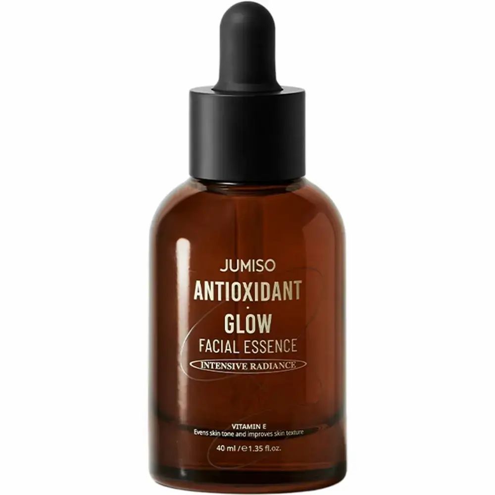 Bruine glazen fles met zwarte dop en pipet. Opschrift: JUMISO ANTIOXIDANT GLOW FACIAL ESSENCE.