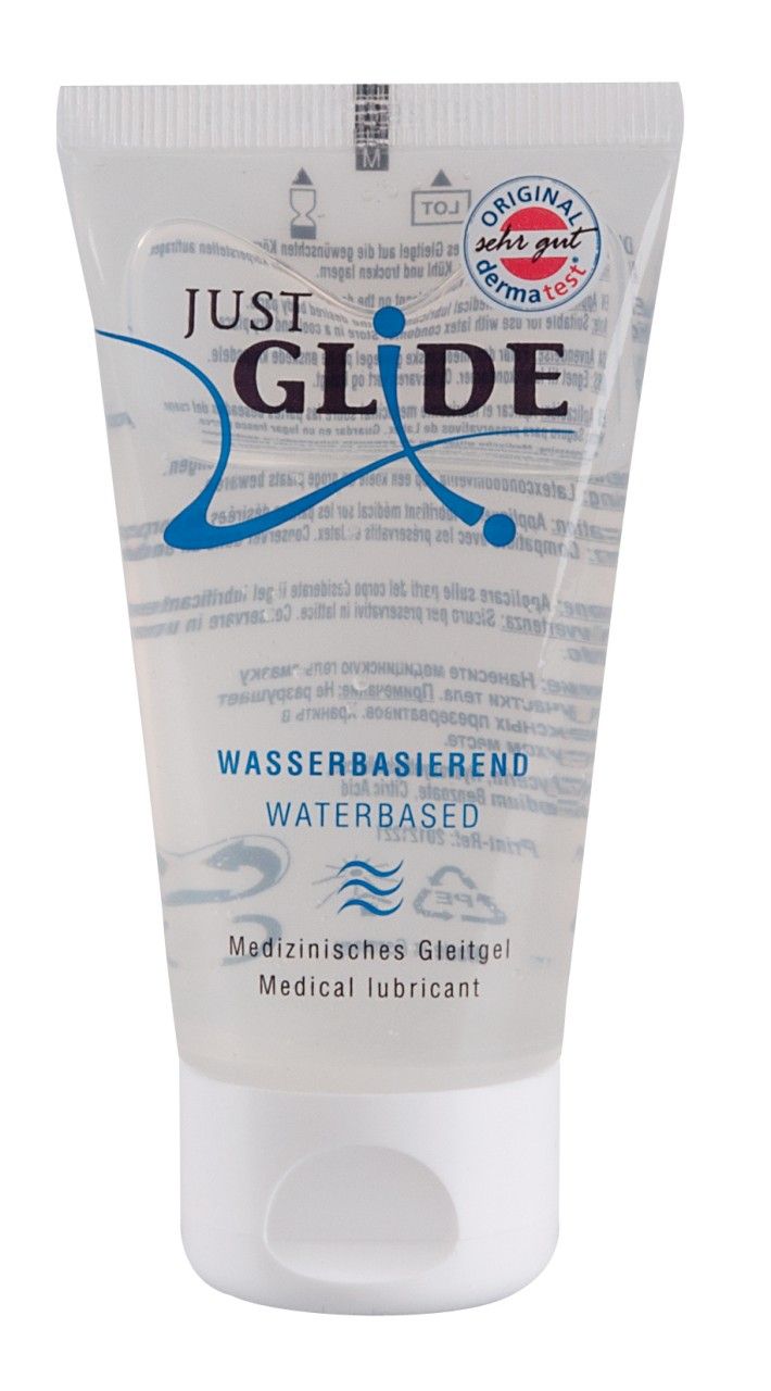 Tube de gel transparent. Inscription : JUST GLIDE, à base d'eau, gel lubrifiant médical. Avec le label 'SEHR GUT'.