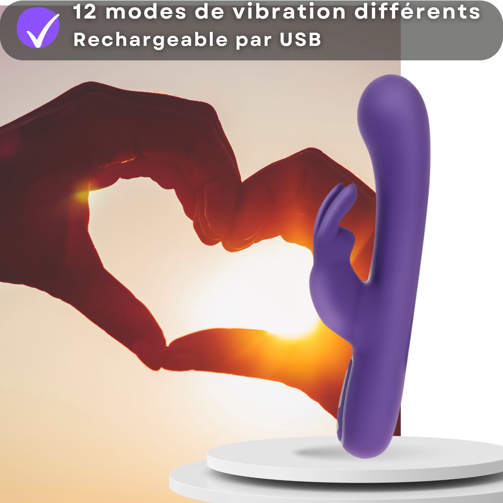 Vibrateur violet. 12 vibrations. Rechargeable USB. Silhouette cœur en arrière-plan.