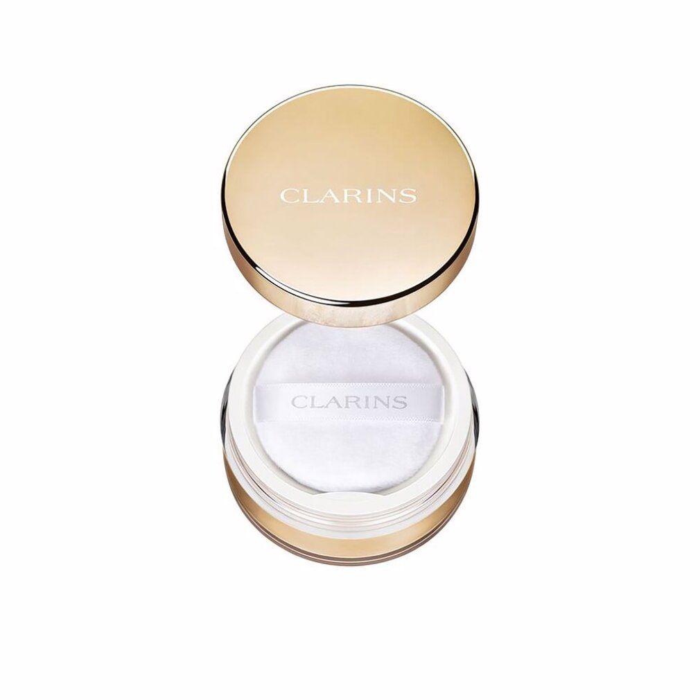 Clarins poeder in een gouden pot met wit poeder en applicator.