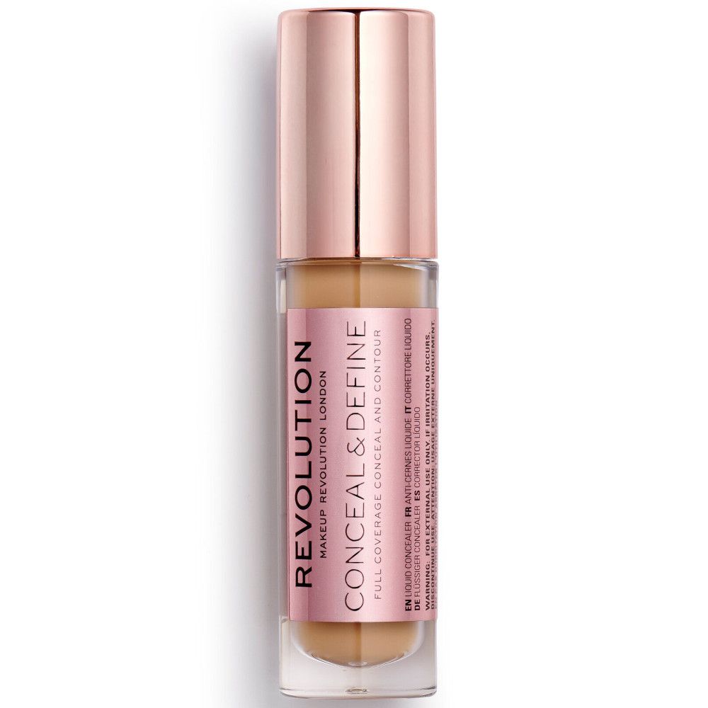 Flacon de correcteur avec bouchon or rose. Inscription: REVOLUTION CONCEAL & DEFINE.