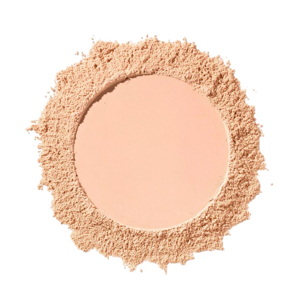 Tourbillon de poudre claire. La poudre entoure un cercle plus clair. Fond blanc.