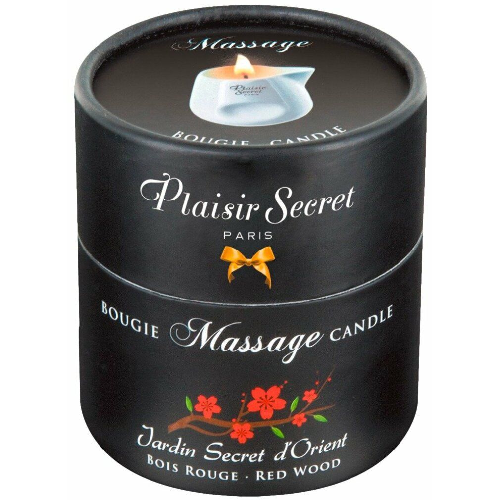 Emballage cylindrique noir. Inscriptions: Plaisir Secret, Bougie Massage, Jardin Secret d'Orient. Décor floral et logo de bougie.