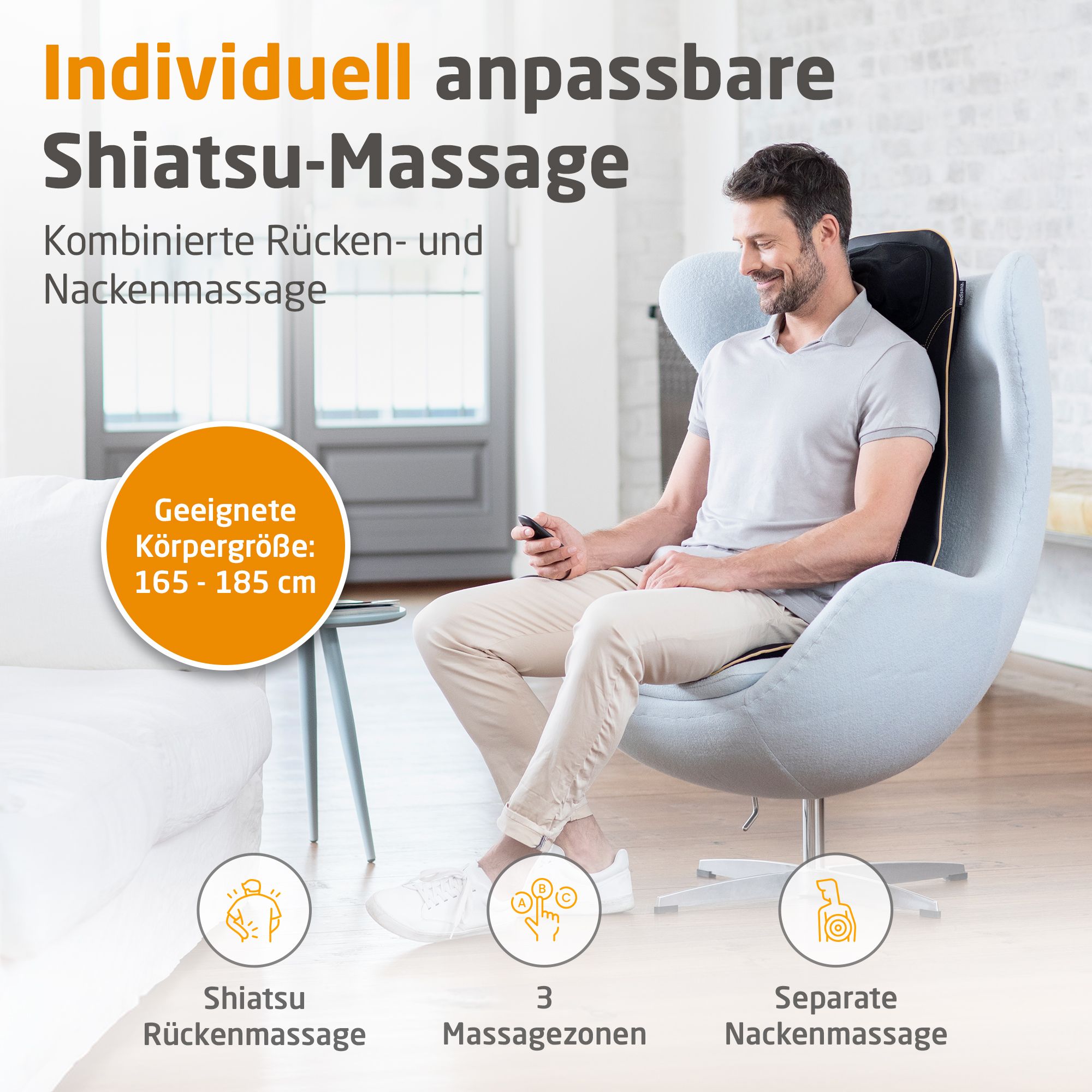 Man zit in stoel met massagekussen. Geschikt voor lichaamslengte 165-185 cm.