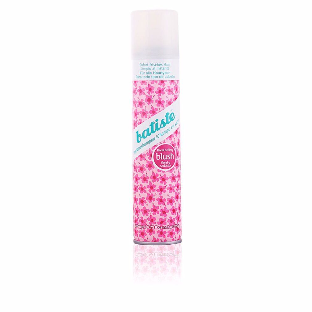 Bombe aérosol rose et blanche. Inscription: Batiste, shampooing sec, Blush. Motif floral.