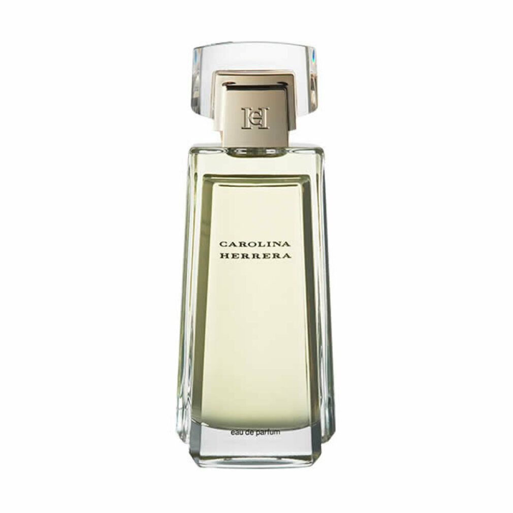 Rechthoekige parfumfles van transparant glas, gouden dop. Opschrift: CAROLINA HERRERA. Eau de parfum.