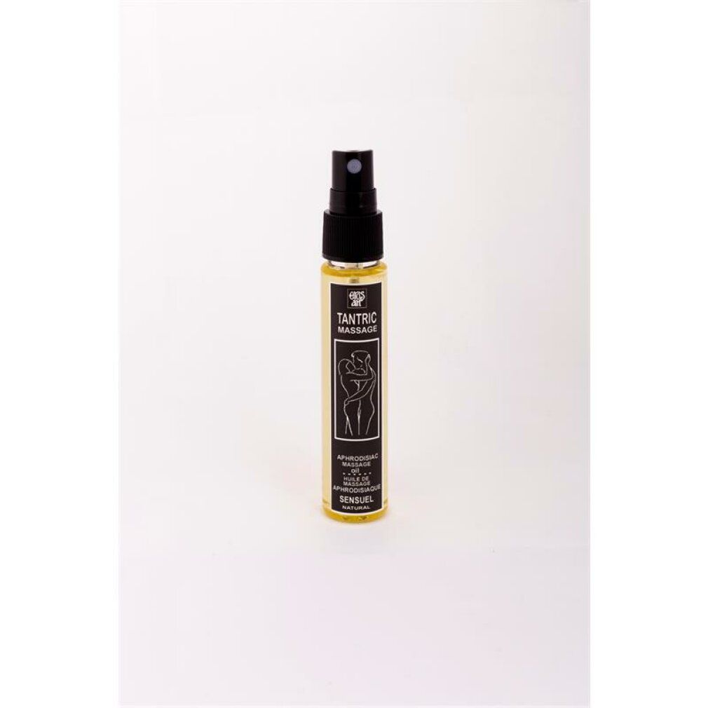 Petite huile de massage tantrique avec pulvérisateur. Liquide jaune dans une bouteille transparente avec étiquette noire et pulvérisateur.