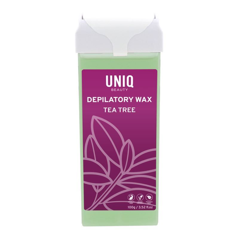 Cartouche de cire verte avec couvercle blanc. Inscription: UNIQ, Depilatory Wax Tea Tree. Étiquette violette avec feuilles.