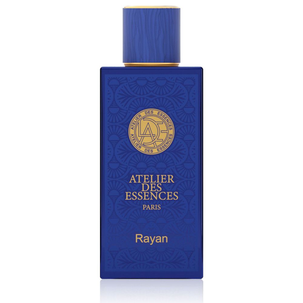 Blauwe parfumfles met gouden details. Opschrift "ATELIER DES ESSENCES PARIS" en "Rayan".