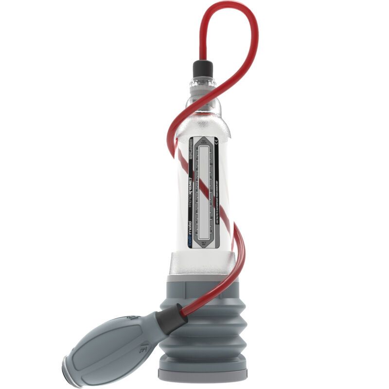 Système hydraulique avec cylindre transparent, soufflet gris et raccord de tuyau rouge. Pompe grise.