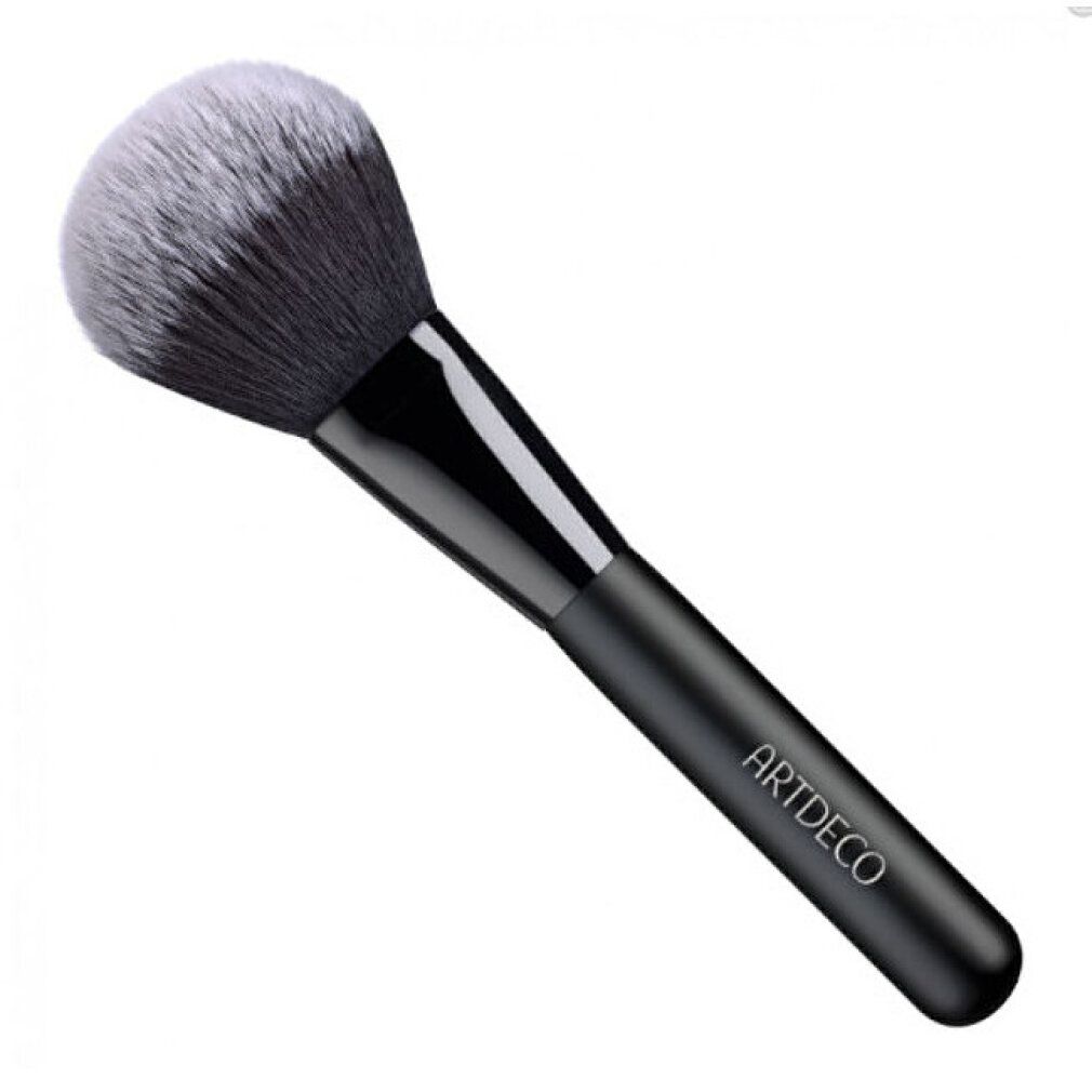 Pinceau à poudre avec manche noir et poils clairs. Le manche porte l'inscription ARTDECO.