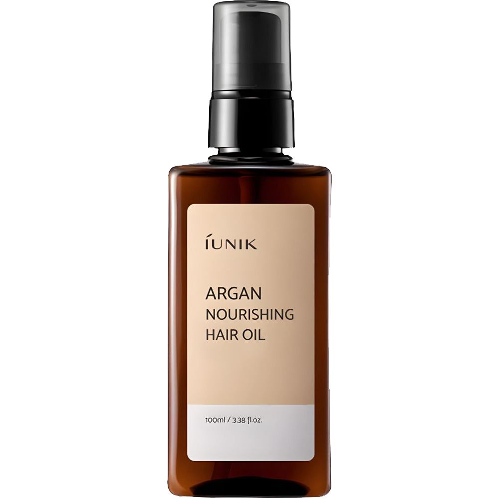 Bruine fles met zwarte pomp. Etiket met productnaam en merk. Tekst: Argan Nourishing Hair Oil.