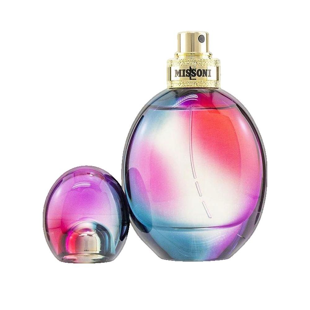 Ronde flacon met losse dop. Kleurovergang van blauw naar roze. Gouden sluiting met "MISSONI" opschrift.