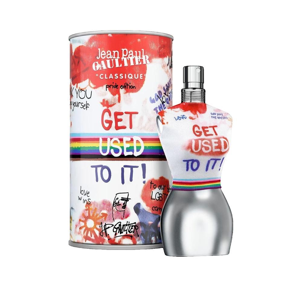 Parfumfles in torso-vorm en doos. Doos met opdruk "Jean Paul Gaultier". Fles met regenboogband. Tekst: "GET USED TO IT!"