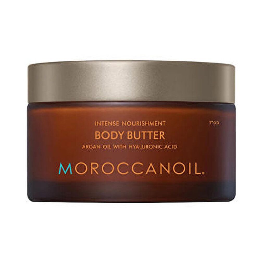 Pot brun avec couvercle doré. Inscription : Body Butter, huile d'argan et acide hyaluronique. Marque : Moroccanoil.
