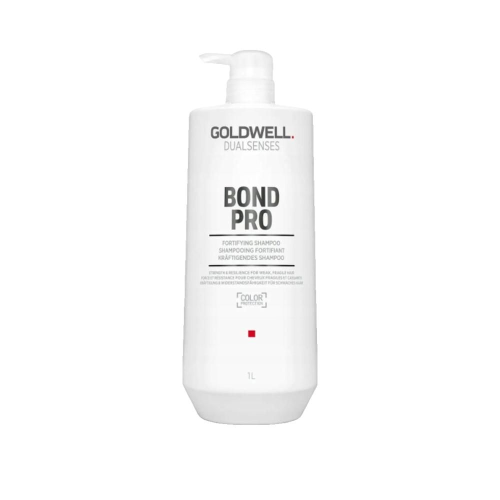 Witte fles met pomp. Opschrift: GOLDWELL DUALSENSES BOND PRO. 1L. Kleurmarkering.