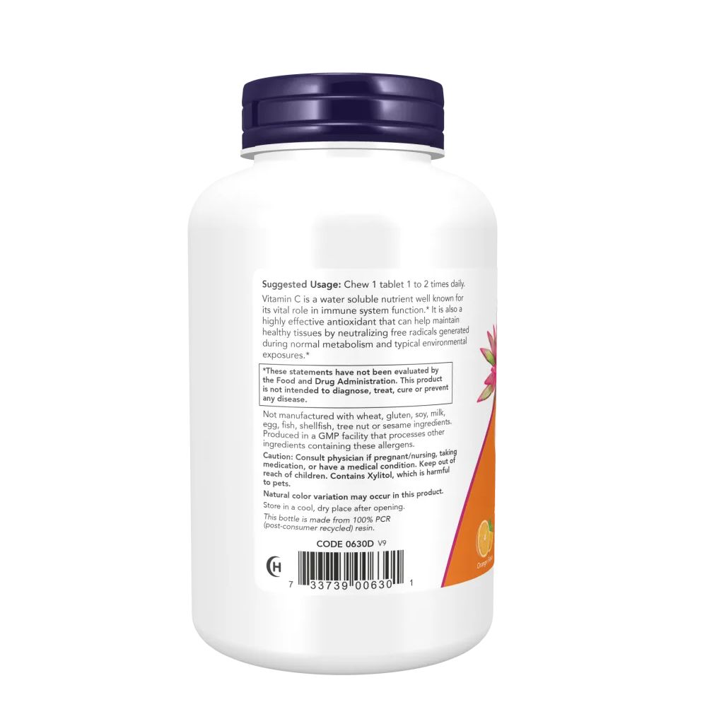 Achterkant van de vitamine C-500 fles. Bevat gebruiksaanwijzingen en waarschuwingen. Witte container met paarse dop.