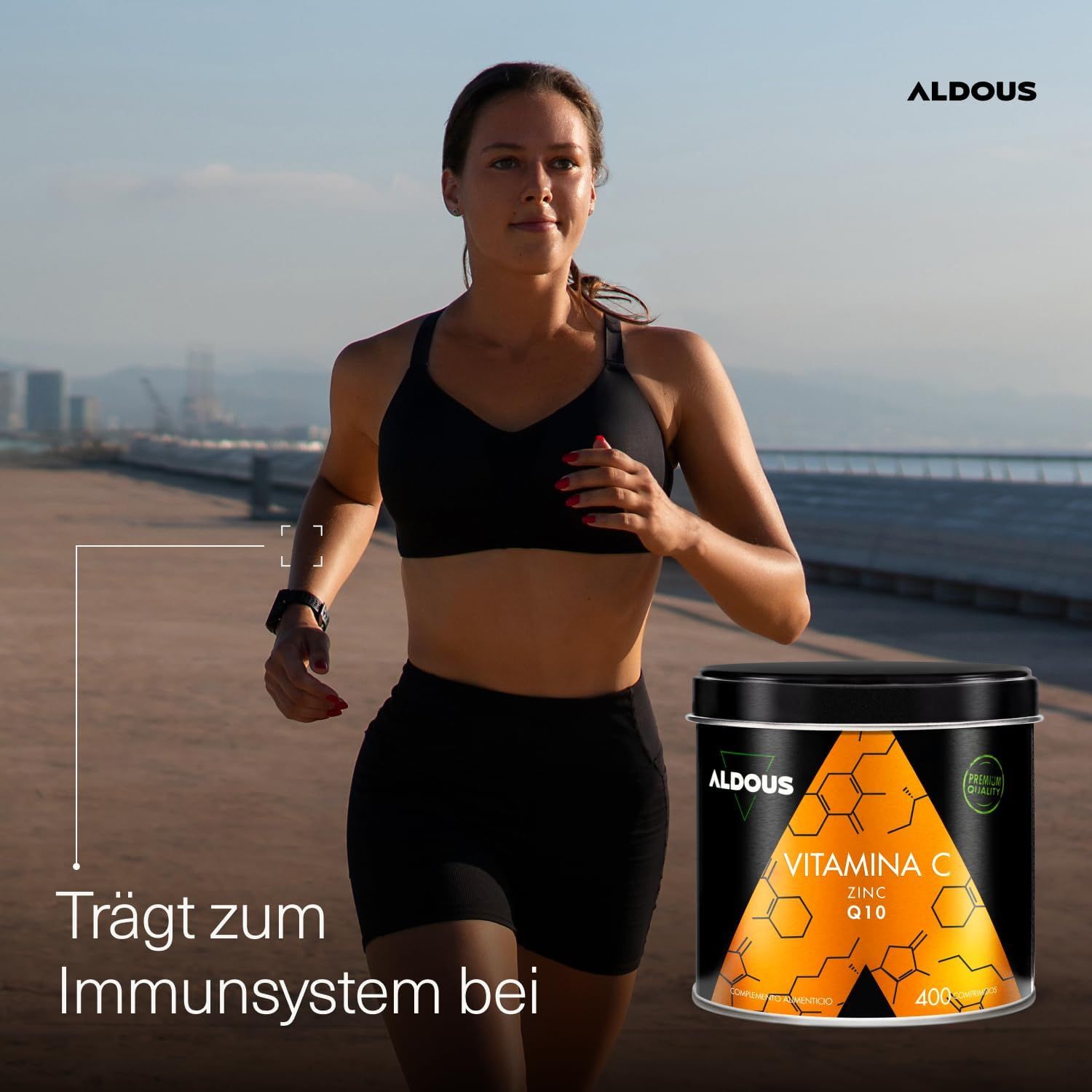 Vrouwelijke hardloper met Aldous Vitamine C blik. Tekst: Draagt bij aan immuunsysteem.
