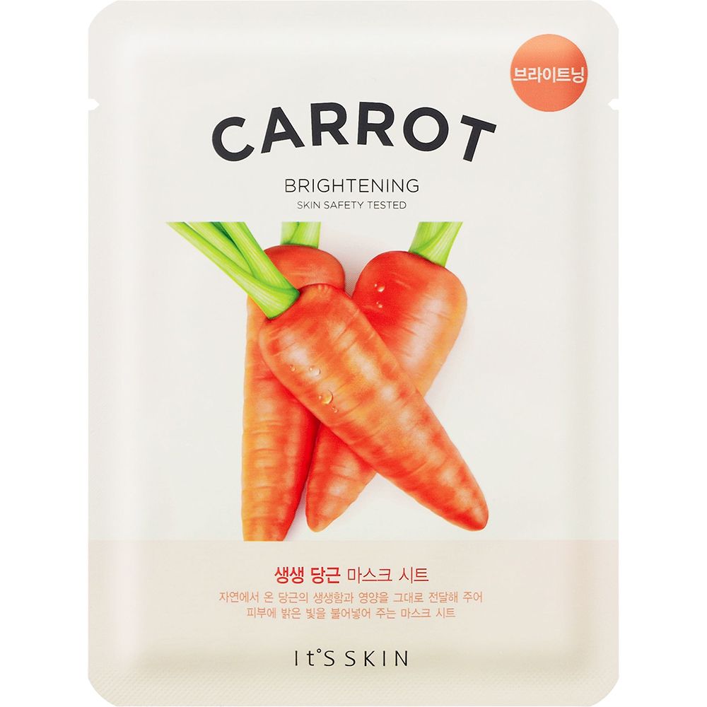 Gezichtsmasker met wortelillustratie. Tekst: CARROT, BRIGHTENING, SKIN SAFETY TESTED. Merk: IT'S SKIN.