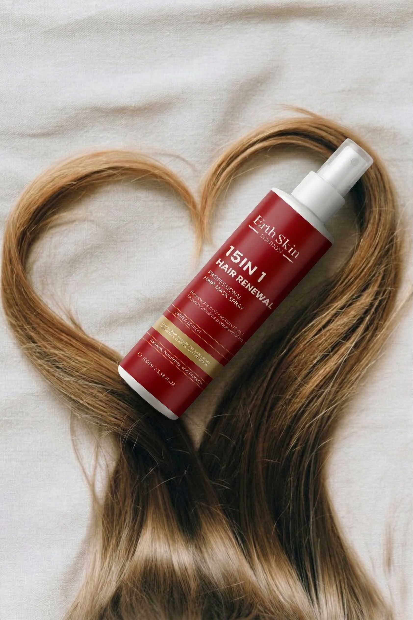 ErthSkin London Spray Haarmasker 15-in-1, fles met haar in hartvorm.