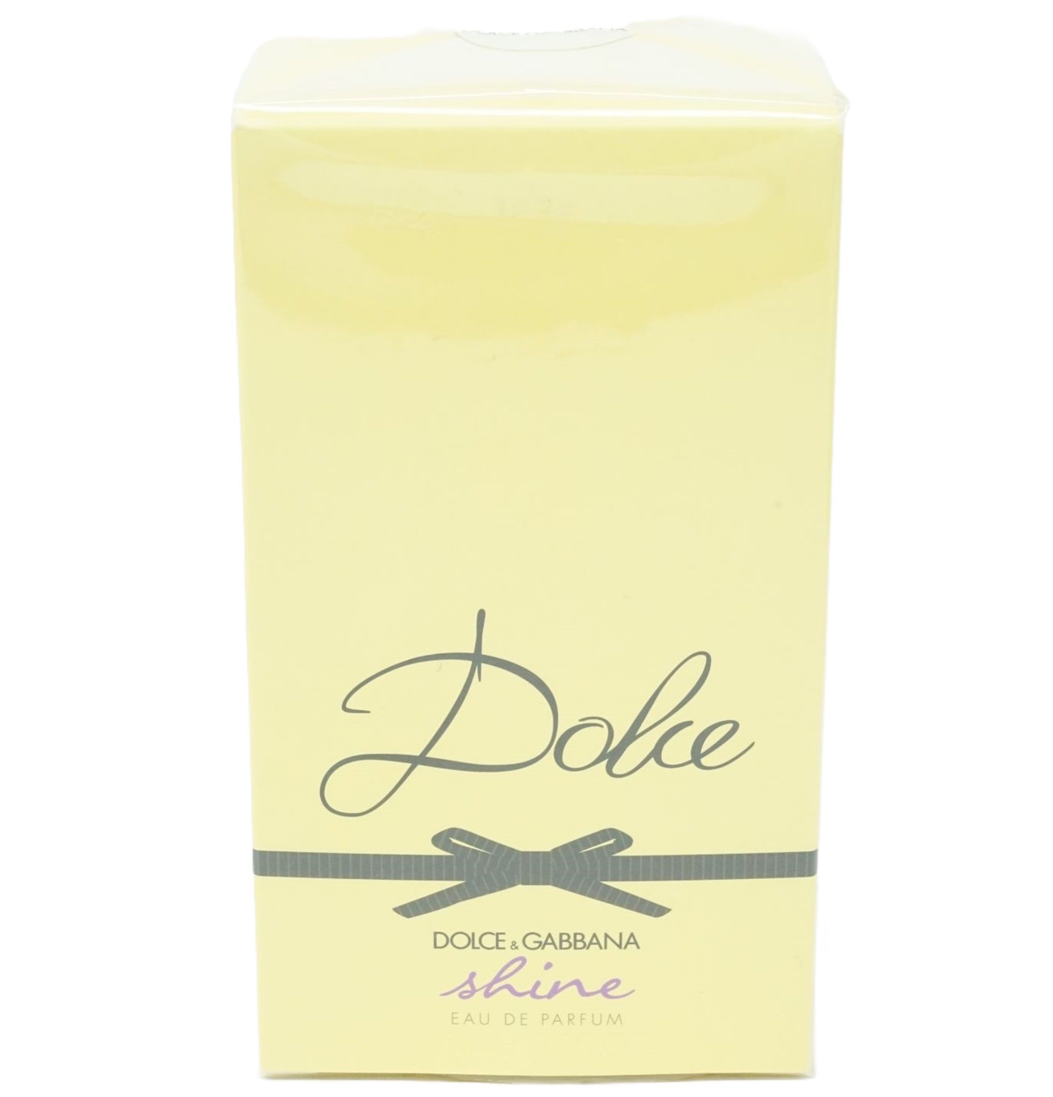 Emballage jaune avec ruban noir et inscription "Dolce & Gabbana Dolce shine".