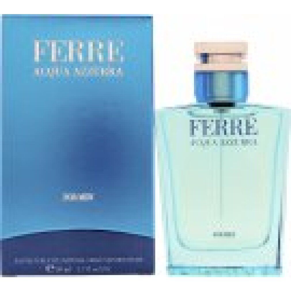 Blauwe transparante fles en doos. Opschrift: FERRÉ AQUA AZZURRA. Voor heren. Vierkante vorm. Lichtblauwe inhoud. Beige-zilveren sluiting.