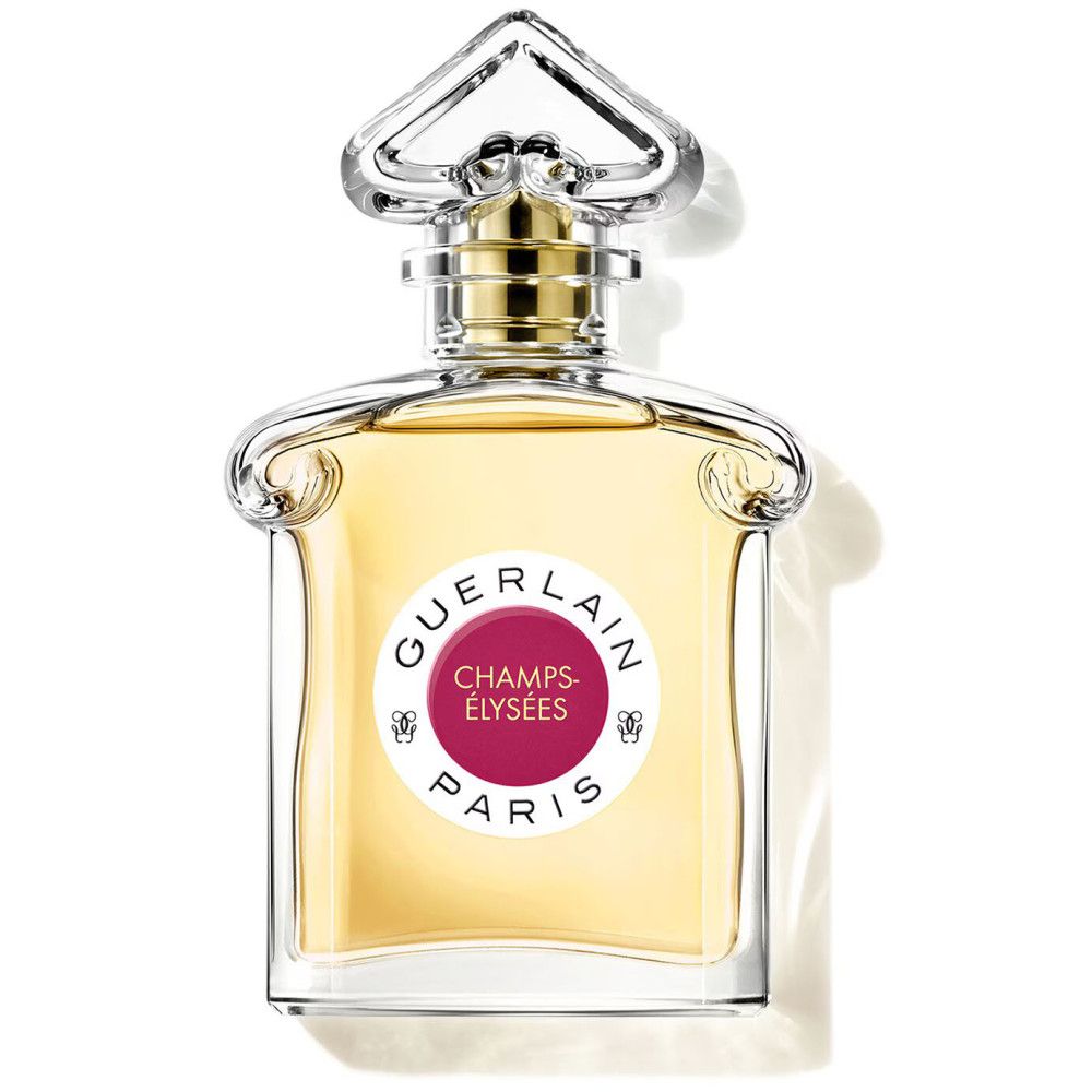 Flacon de parfum avec étiquette ronde. L'étiquette porte "GUERLAIN PARIS" et "CHAMPS-ÉLYSÉES". Le flacon est en verre.