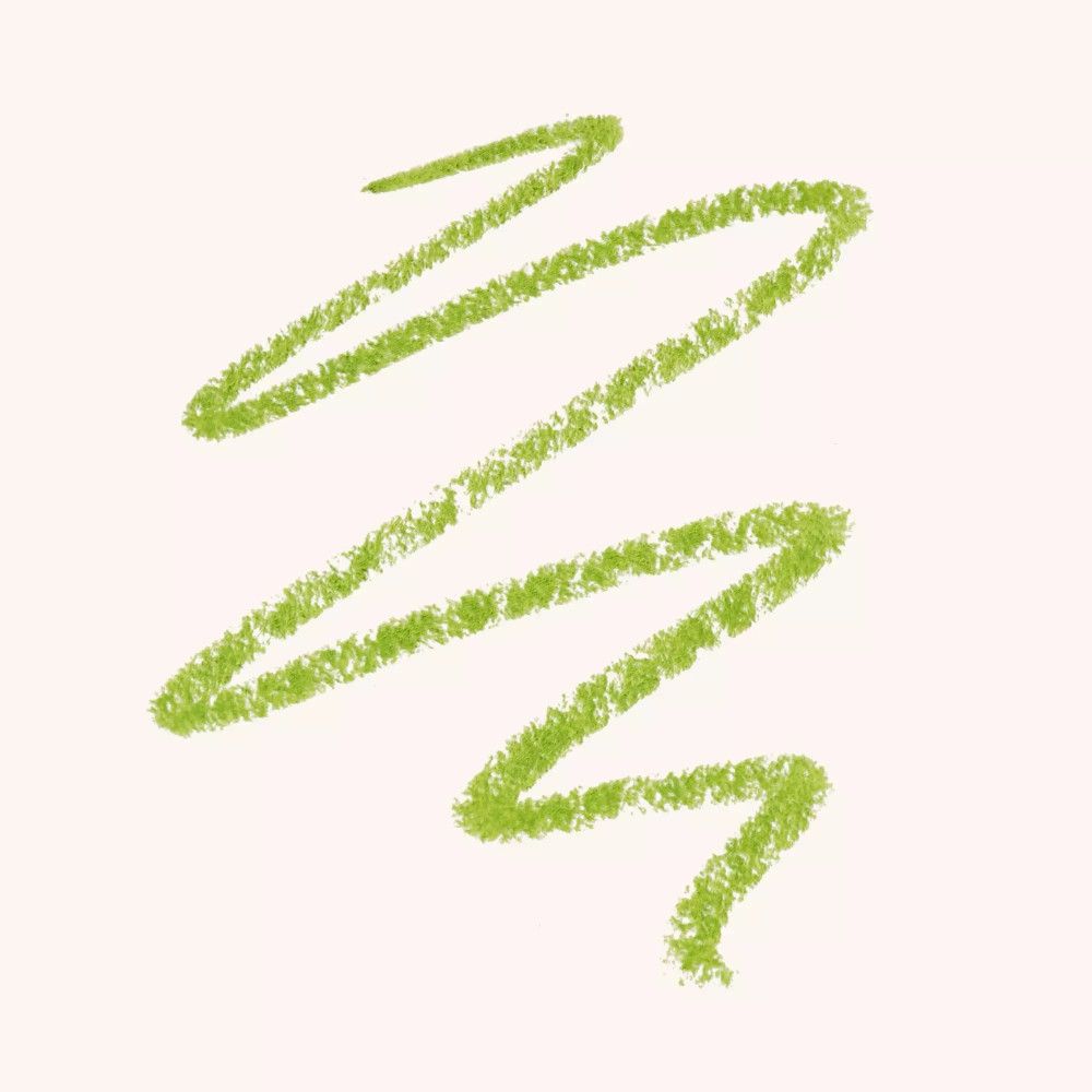 Trait de khôl vert sur fond clair.