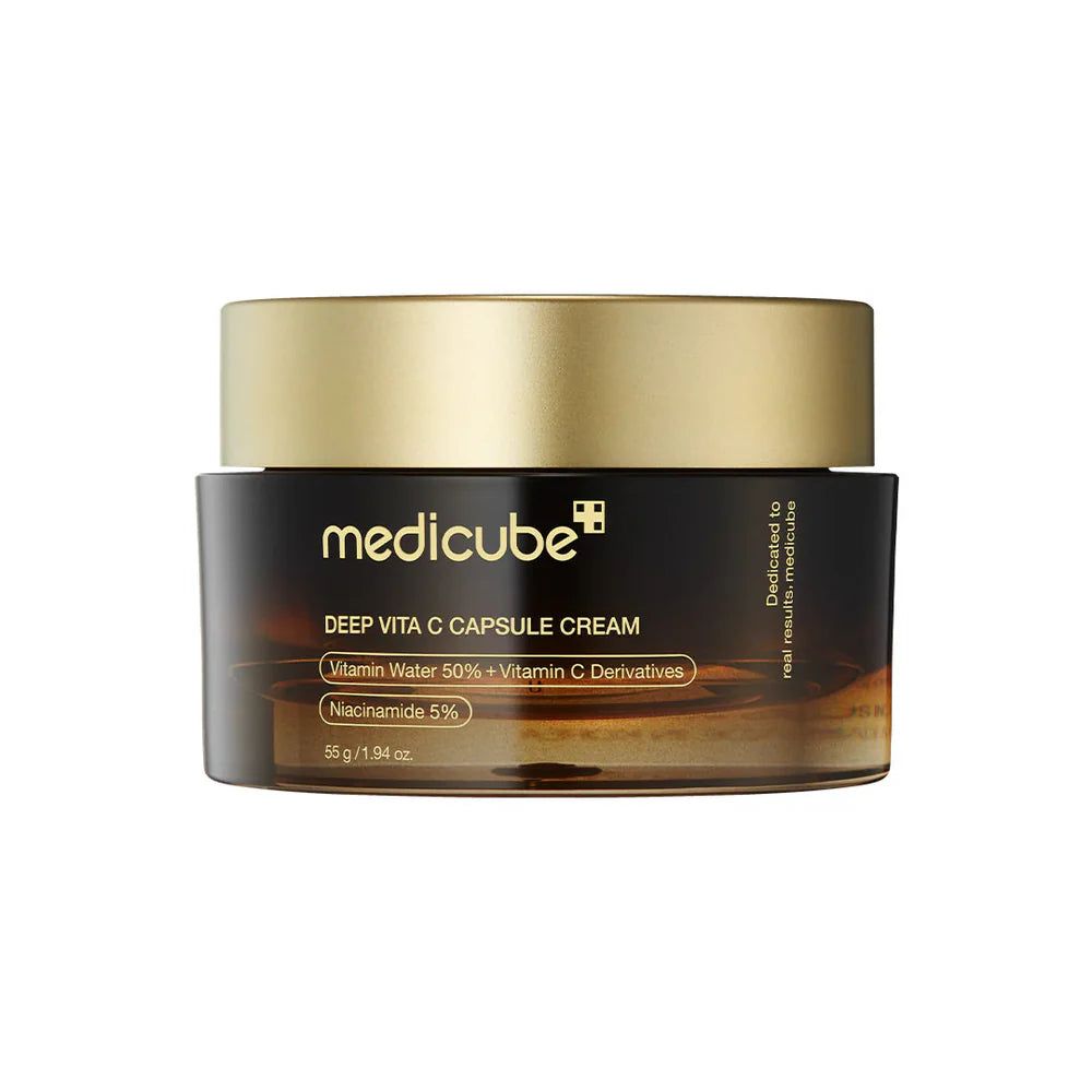 Crème en capsules Medicube Deep Vita C dans un pot brun avec un couvercle doré.