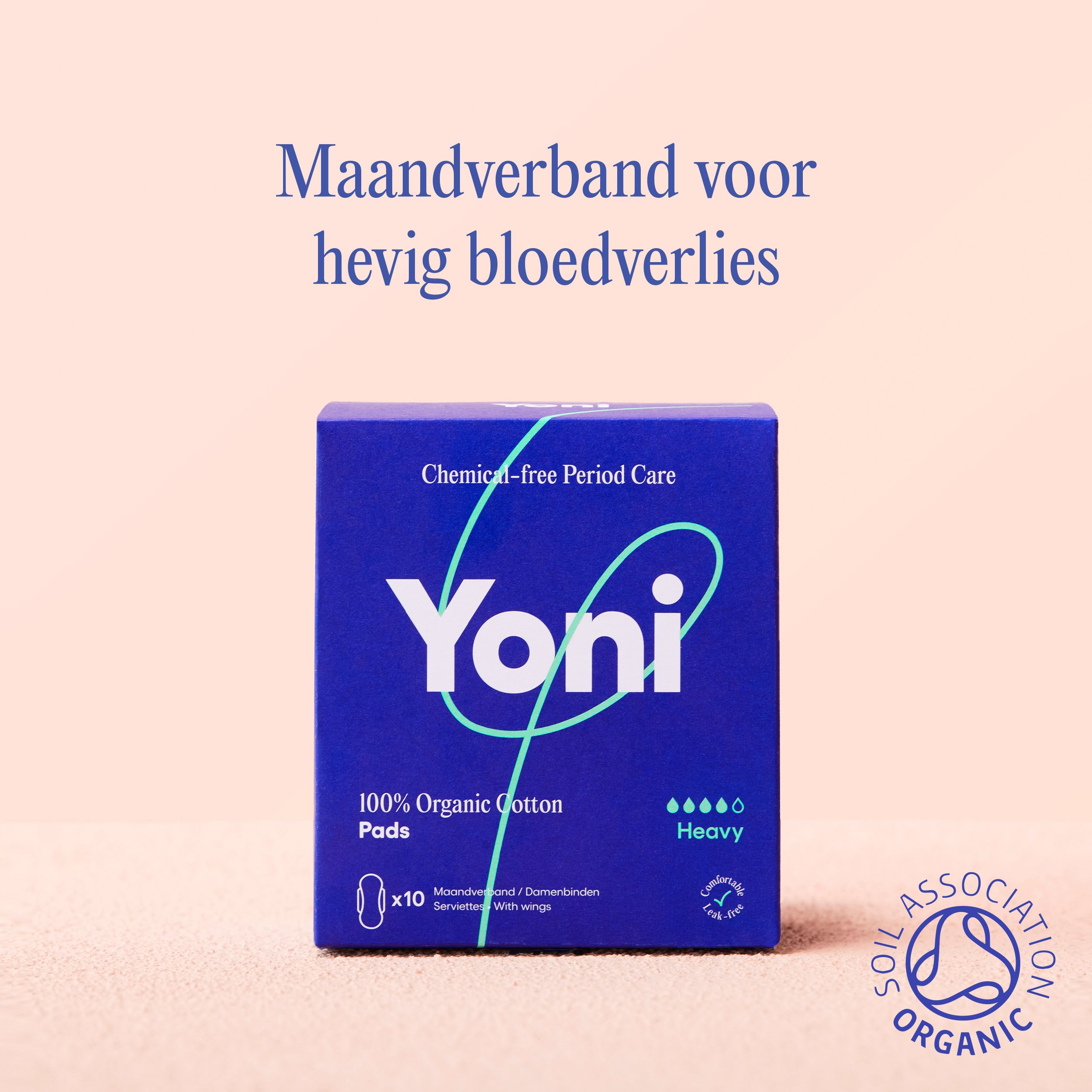 Blauwe doos maandverband. Opschrift: Yoni, 100% biologisch katoen, Heavy. SOIL ASSOCIATION ORGANIC.