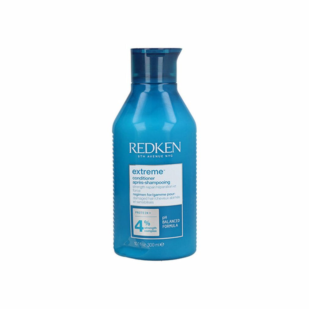 Lichtblauwe fles Redken Extreme Conditioner. Opschrift: Extreme, Conditioner, pH Balanced Formula. 300ml.