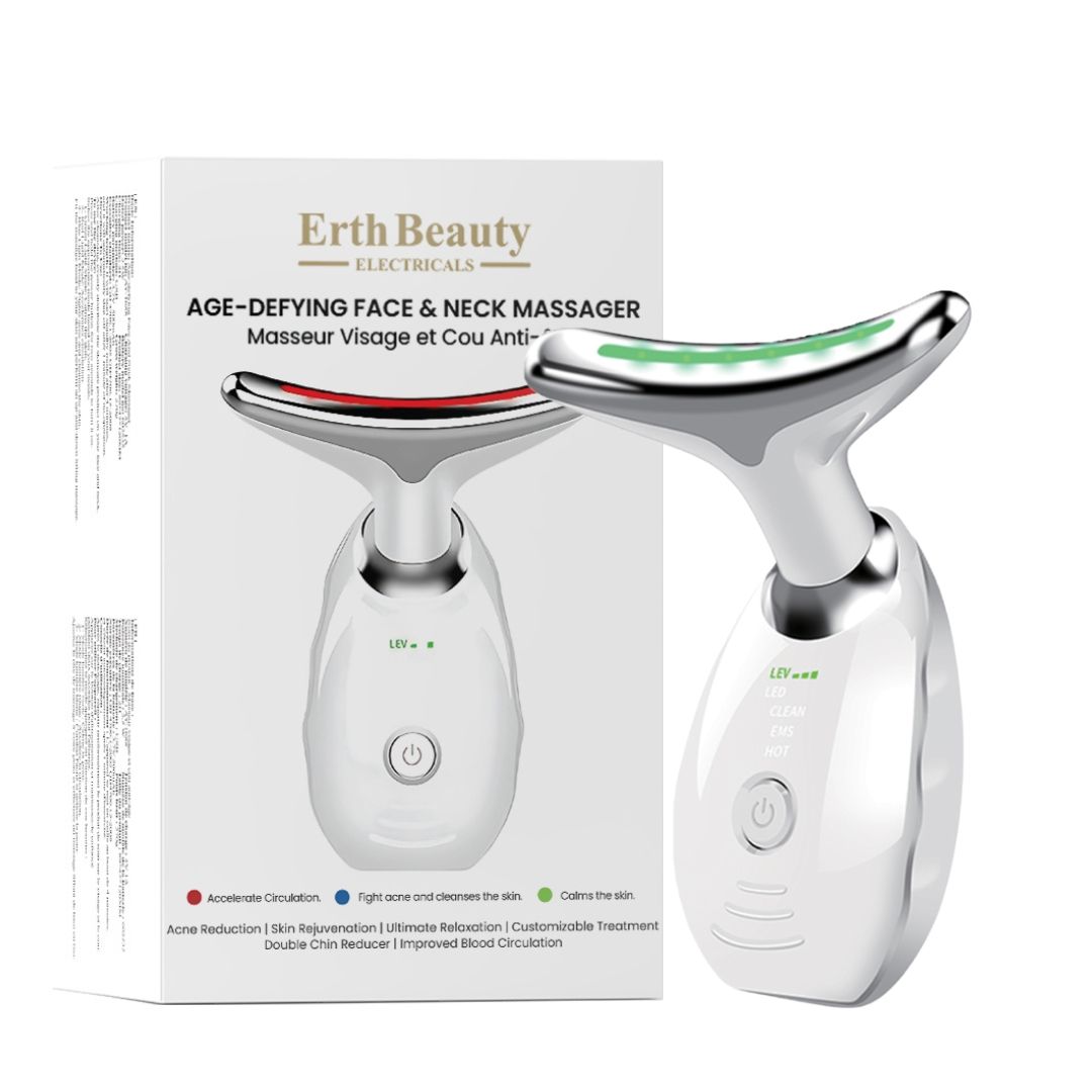 Gezichts- en nekmassager naast de verpakking, beide wit met zilveren accenten.