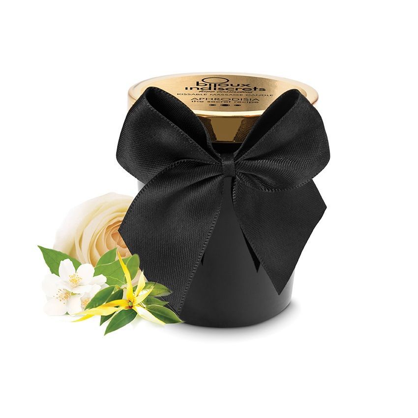 Bougie noire avec nœud, couvercle et fleurs. Inscription sur le couvercle. Bijoux Indiscrets.