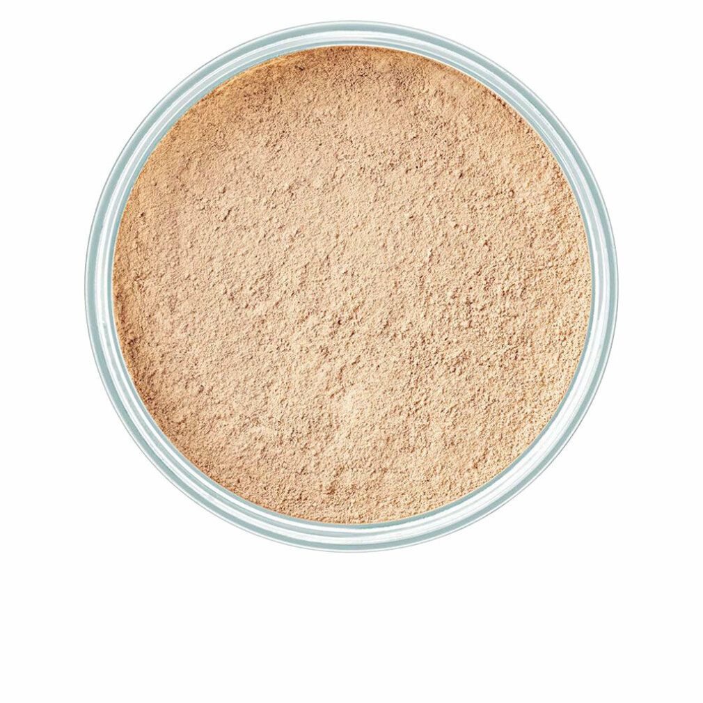 Vue de dessus d'un récipient de poudre libre. Couleur beige.