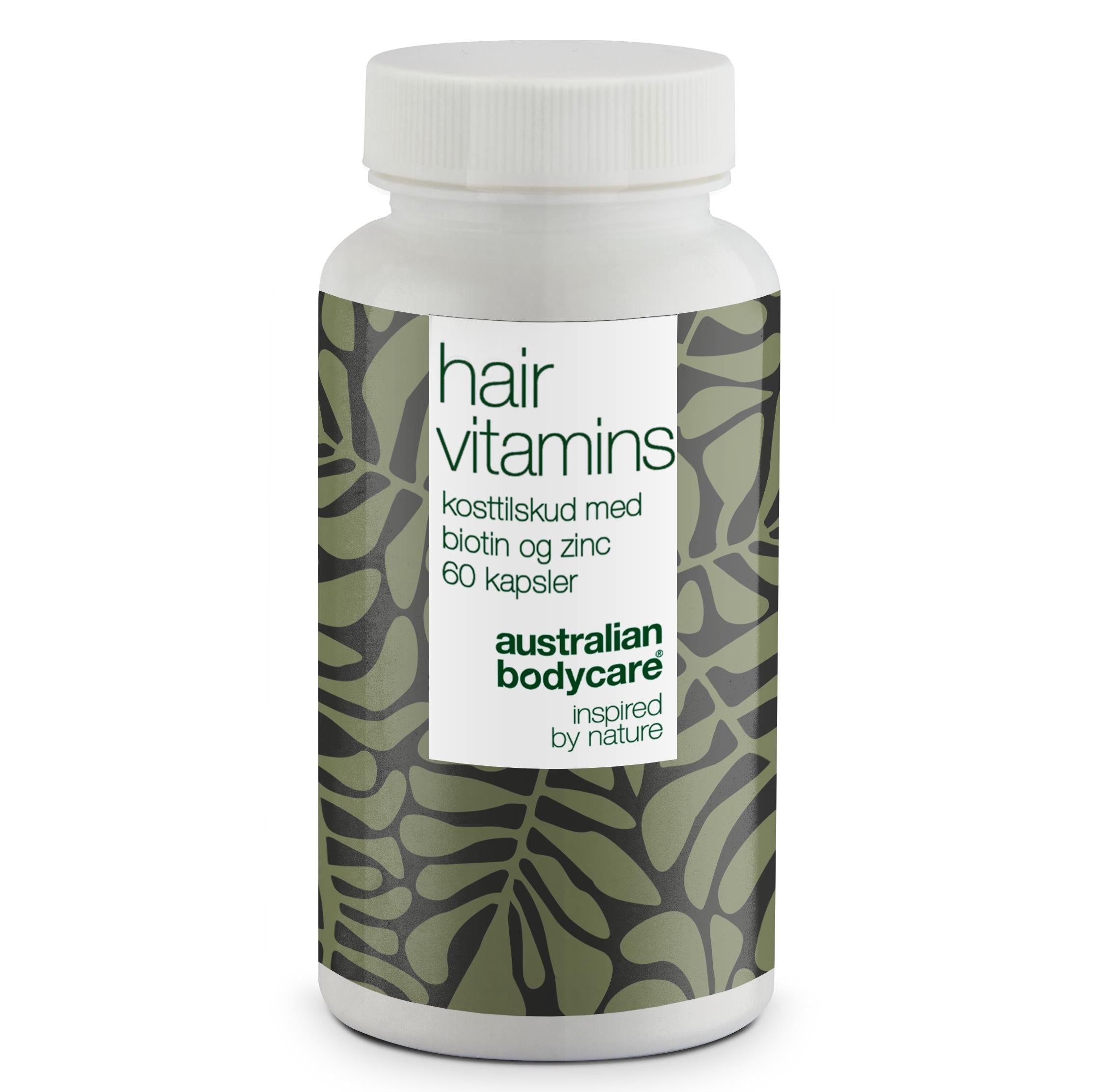 Witte fles met capsules. Opschrift: Hair Vitamins, biotine en zink, 60 capsules. Merk: Australian Bodycare.