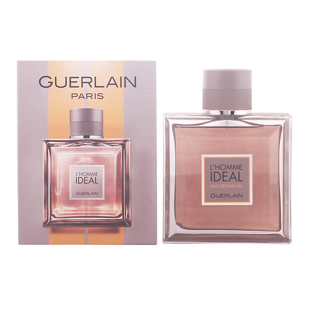 Fles en verpakking. Opschrift: L'Homme Ideal, Guerlain Paris. Vierkante fles, roze vloeistof, grijze dop. Verpakking met logo.