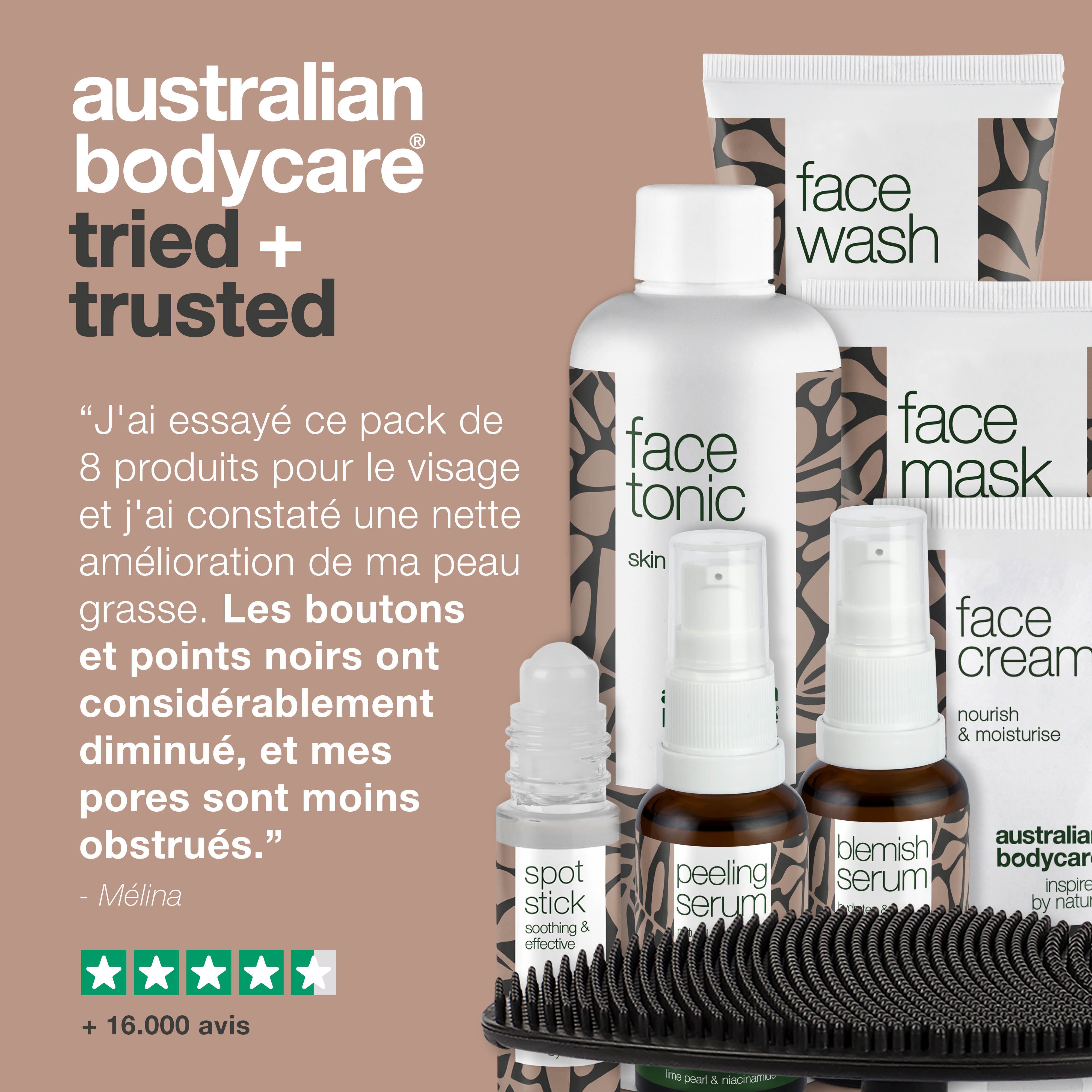 Blemish Serum en flacon de verre brun avec vaporisateur. Autres produits et brosse en arrière-plan. Texte : Zinc & Niacinamide 10%.