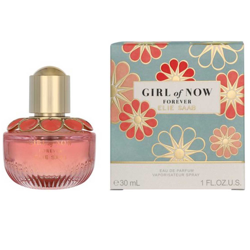 Flacon de parfum et emballage. Flacon rose, bouchon doré, décor floral. Emballage à motifs floraux et texte.