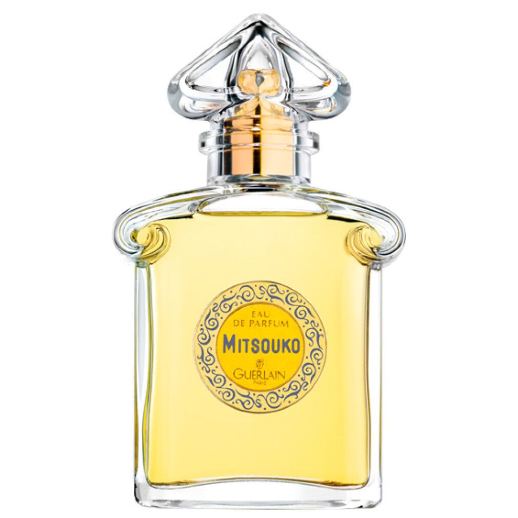 Guerlain Mitsouko Eau de Parfum fles. Vierkante vorm, gouden dop, gele vloeistof. Met tekst.