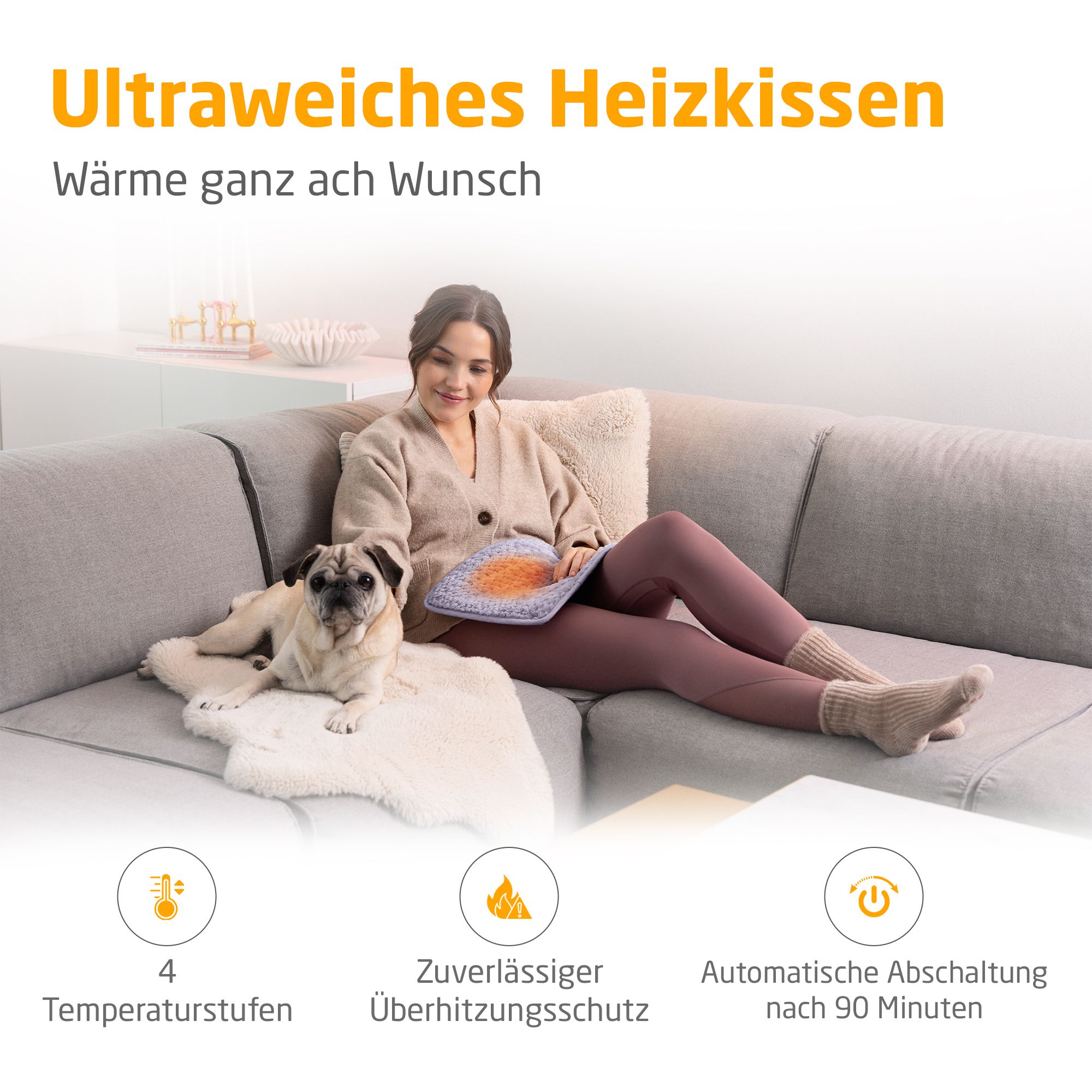 Verwarmingskussen, lichtpaars. Vrouw op bank met hond. 4 temperatuurstanden, oververhittingsbeveiliging.