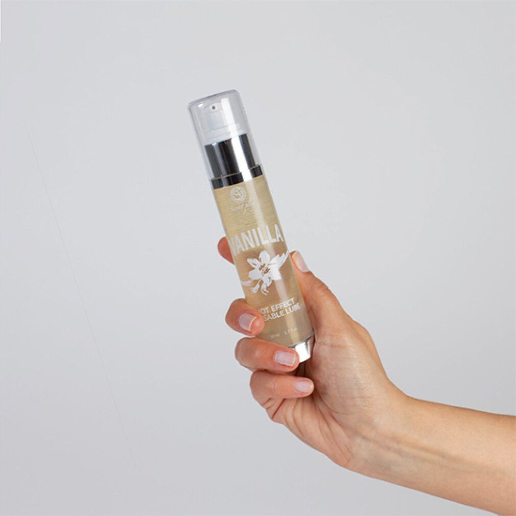 Fles met "Vanilla" in hand. Doseerpomp, transparante dop.